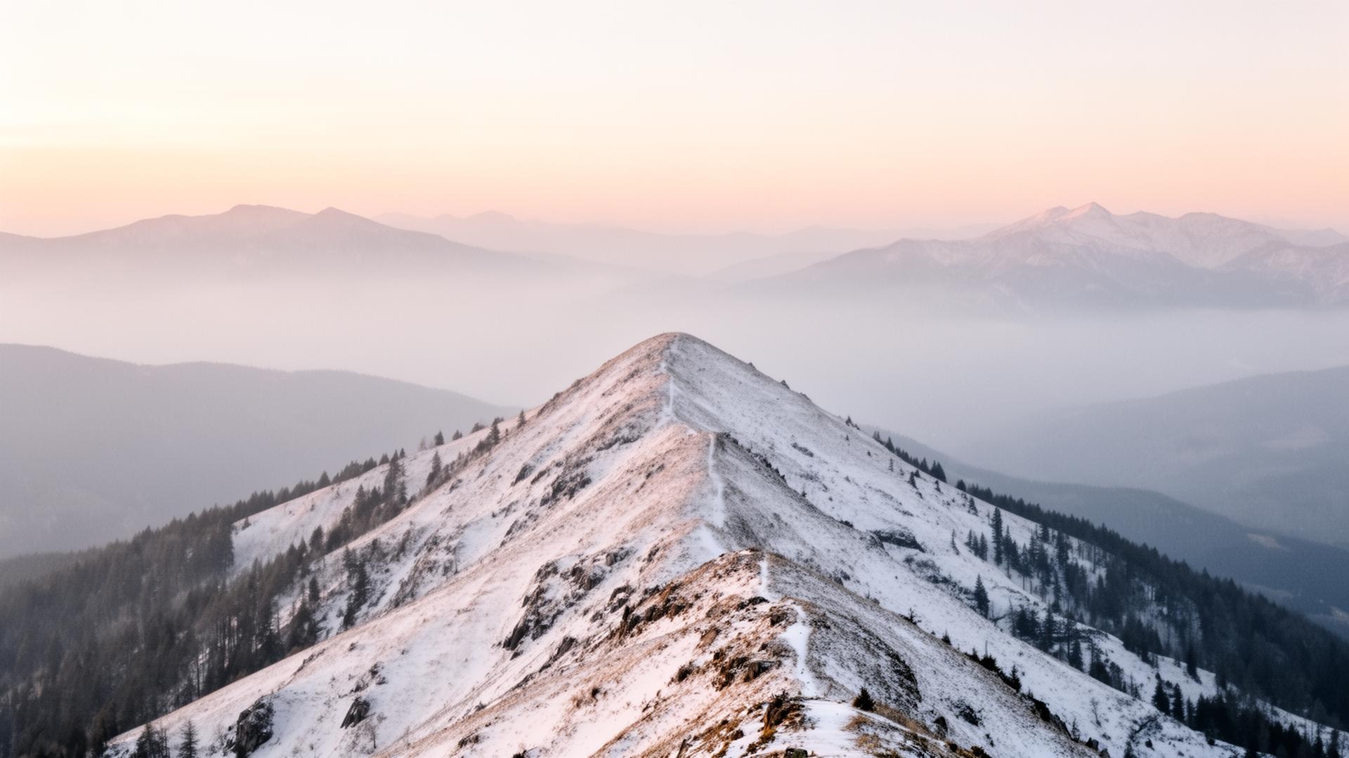 Snow-covered Nordic mountain ridge at dawn